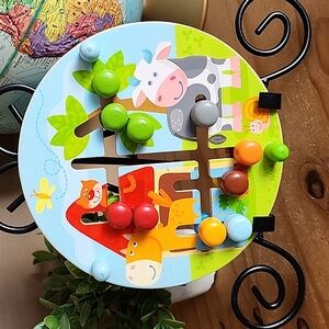 HABA On the farm double sided motor skills board